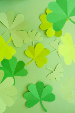 Happy St.Patrick's Day, shamrock cut from paper on white background, text greeting card rasterの写真素材