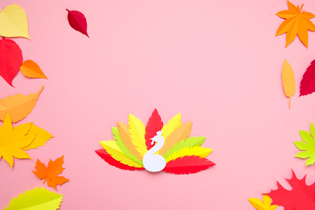 multi-colored turkey tail made of paper on a pink background. Thanksgiving conceptの写真素材