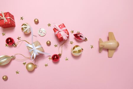 wooden children's plane on a pink background. Merry christmas conceptの写真素材