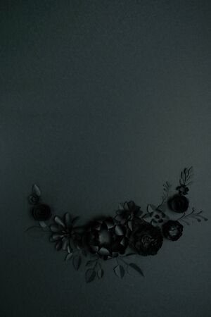 Black paper flowers on Black background. Cut from paper. Gothic frame. Total black. BLack friday concept.の写真素材