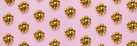 Merry christmas and happy new year. Holiday pattern with gold decorations and gift boxes on pink...
