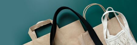 String bag, cotton bag and paper bags for free plastic purchases on a dark green background. Zero...