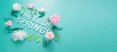 Hello, spring With white and rose paper flowers on mint background. Tenderness concept