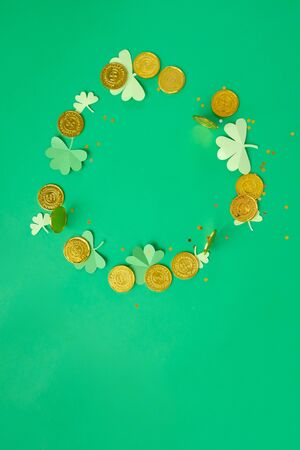 St. Patrick's day, clover and gold coins on a green background. St. Patrick's symbolsの写真素材