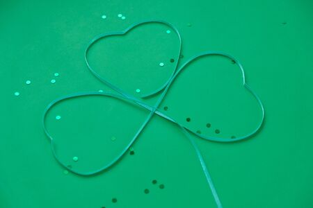 St. Patrick's day, clover cut out of paper on a green backgroundの写真素材