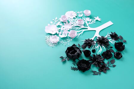 Healthy lung in the form of white paper flowers , and affected lung in the form of black paper flowers. Healthy conceptの写真素材