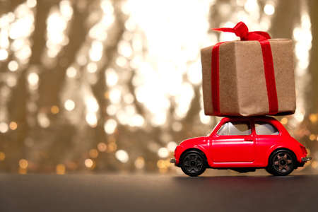 Blackground of abstract glitter lights. Gold and black. De focused.の写真素材