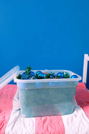 Christmas blue toys in a plastic container