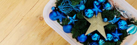 Christmas blue toys in a plastic containerの写真素材