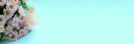 Pink chrysanthemums, orchid and different flowers on blue background.の写真素材