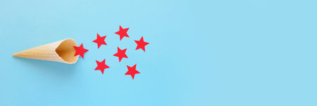 Waffle cone with red stars on blue background. The red star is the symbol of the army. February 23...