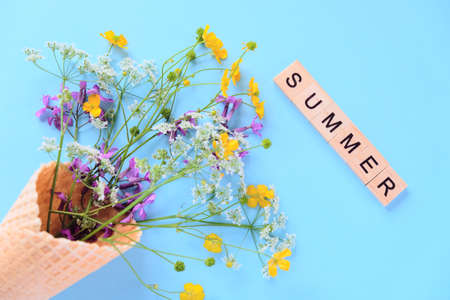 Bouquet of wild flowers in a waffle cone. Summer concept.の写真素材