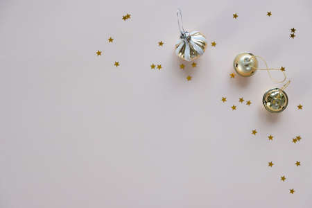 Christmas background with decorations on pink background