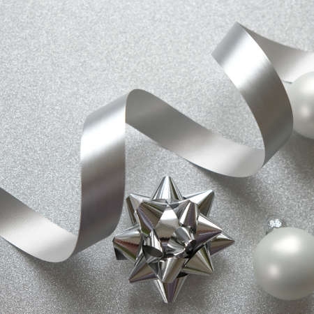 Happy new year and Merry Christmas. Background of Christmas silver elements on glitter silver background. Long format for webの写真素材