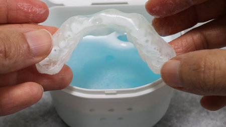 A person holding a cleaned mouthpieceの写真素材