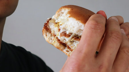 Man eating a hamburgerの写真素材