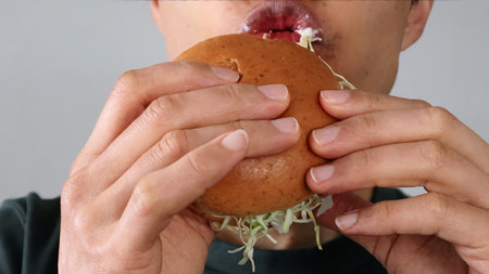 Man eating a hamburgerの写真素材