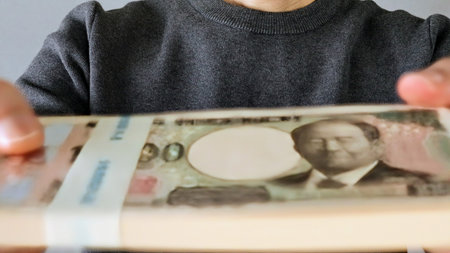 Close-up of a person holding 1 million yen