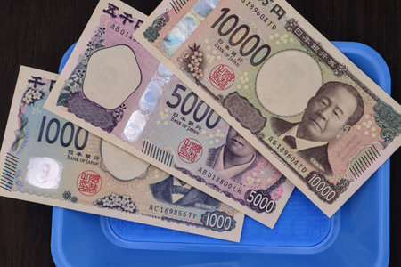 New Japanese banknotes on a tray