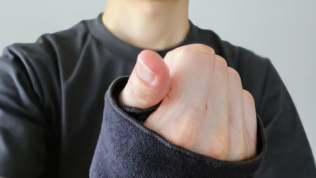Close-up of a person with a supporter on their handの写真素材