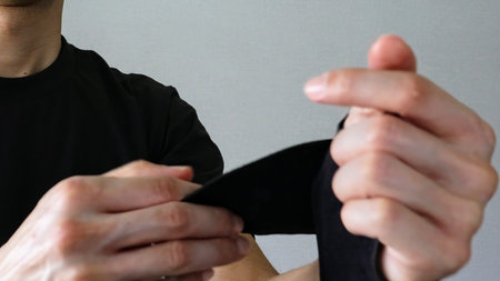 A person wearing a supporter on their handの写真素材