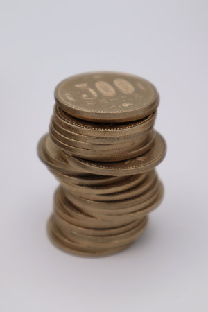 Close-up of stacked 500 yen coins
