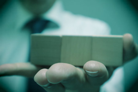A person holding a building block.の写真素材
