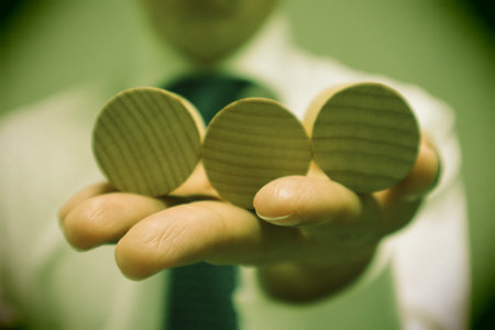 A person holding a building block. Please write your favorite letters on the building blocks.の写真素材