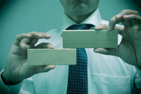 A person holding a building block.の写真素材