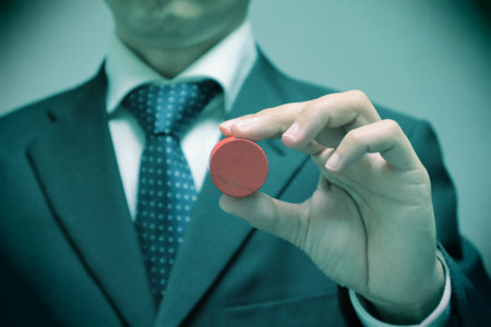 A person holding a building block.の写真素材
