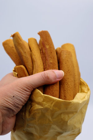 A person holding a poppoyaki
