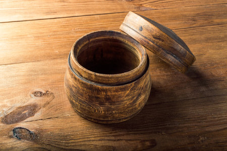 Blank wooden bowl on the table background.の写真素材