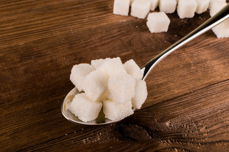 Diabetes. A lot of sugar cubes in spoon.の写真素材