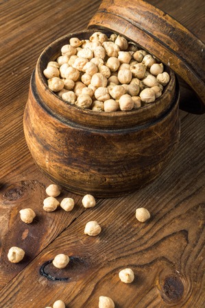 Portion of Chick Peas in wooden bowl.の写真素材