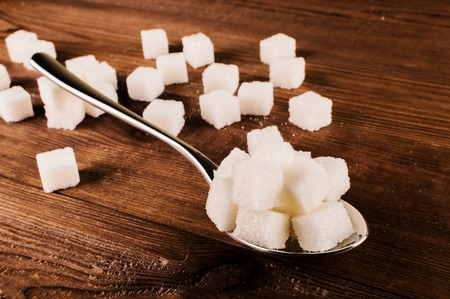 Diabetes. A lot of sugar cubes in spoon.の写真素材