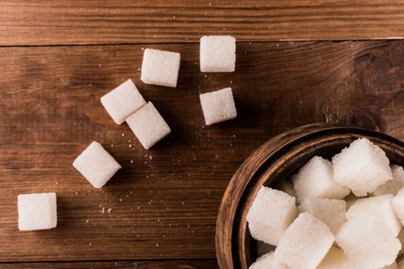 Diabetes. A lot of sugar cubes in jar.の写真素材