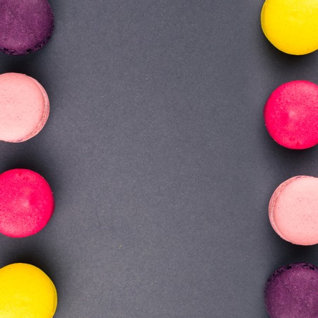 Colourful french macaroons on the grey backgroundの写真素材