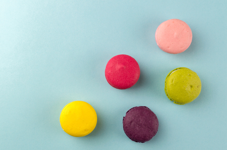Colourful french macaroons on the blue backgroundの写真素材