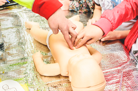 Demonstrating chest compressions. CPR training medical procedure.