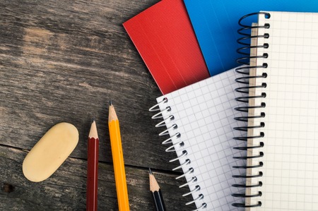 Back to School, supplies, notebook on the grey background.