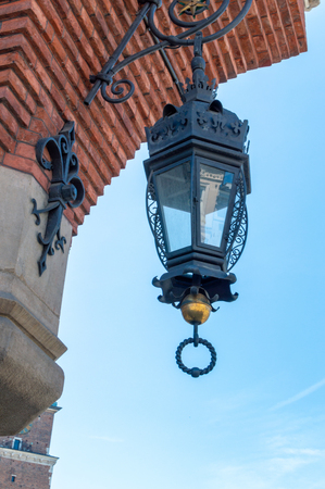 Lamp on the old building in Krakow. Square of marketの写真素材