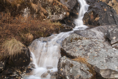 GOKYO, NEPAL - CIRCA OCTOBER 2013: waterfall in the Himalayan slope circa October 2013 in Gokyo.の写真素材
