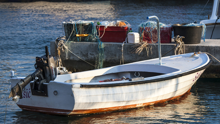 HVAR, CROATIA â CIRCA SEPTEMBER 2016: motor boat in the harbor in the village of Sveta Nedilja on the island of Hvar circa September 2016 in Hvar.のeditorial素材