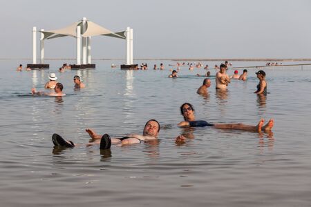 EIN BOKEK, ISRAEL - CIRCA MAY 2018: People floating in Dead Sea circa May 2018 in Ein Bokek.のeditorial素材