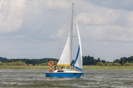 MIKOLAJKI, POLAND - CIRCA AUGUST 2020: A view of the sailboats on Lake Sniardwy circa August 2020 in Mikolajki.のeditorial素材