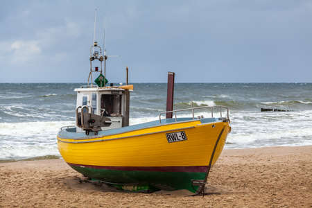 NIECHORZE, POLAND - CIRCA AUGUST 2021: Fishing boat on the beach in Niechorze circa August 2021 in Niechorze.のeditorial素材