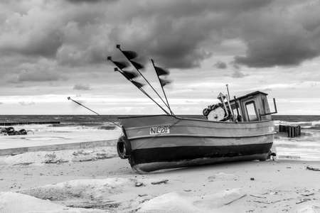 NIECHORZE, POLAND - CIRCA AUGUST 2021: Fishing boat on the beach in Niechorze circa August 2021 in Niechorze.のeditorial素材