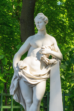 Saint Petersburg, RUSSIA - May 28, 2018: A female nude sculpture in a serene gardenin the Summer Garden in St. Petersburgのeditorial素材