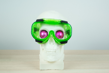 Snorkeling scuba diving skull sculpture with pink eyes with maskの写真素材