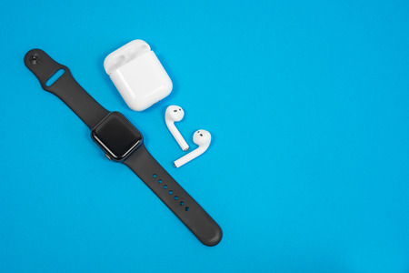 ROSTOV-ON-DON, RUSSIA - February 24, 2019: Apple Watch Series 4 and AirPods wireless Bluetooth...
